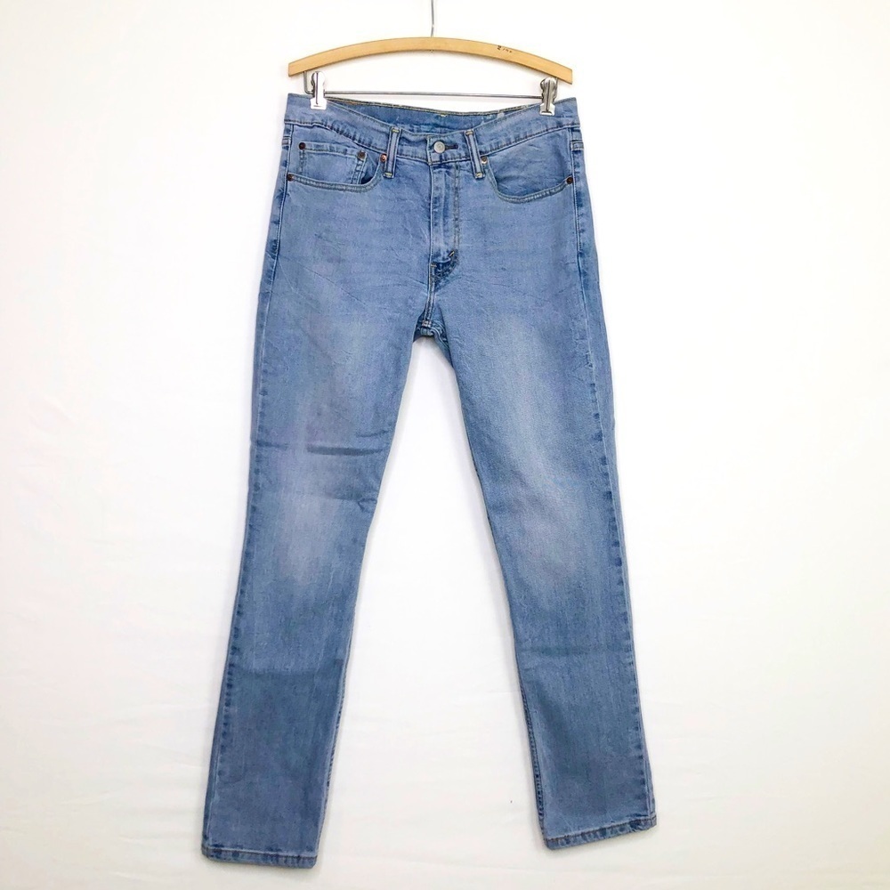 Levi 511 medium wash straight leg, high rise, blank tab jeans
